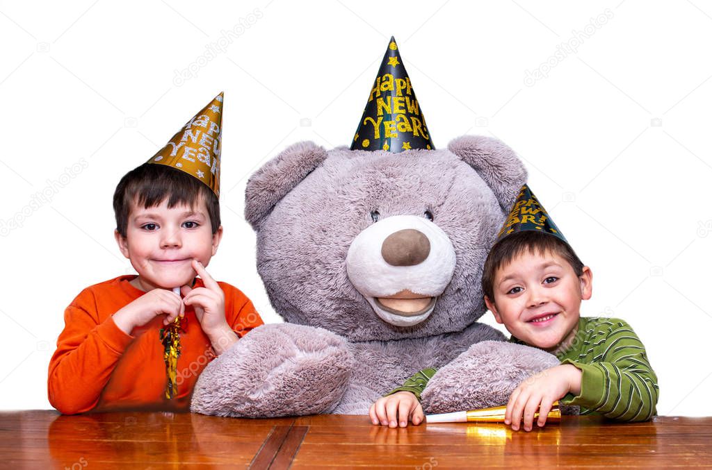 brothers pose with teddy bear on new years eve