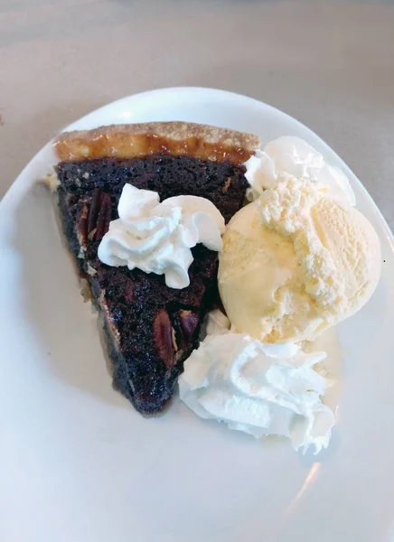 hot, chocolate pecan pie with ice cream