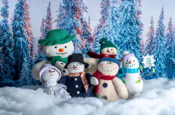 Group of snow people against a snow backdrop — Stock Photo, Image
