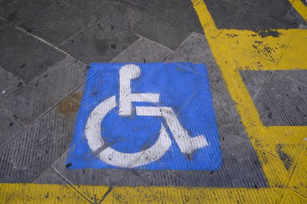 Space Handicapped parking spot in open parking in Siena, Italy on Oct. 27, 2019