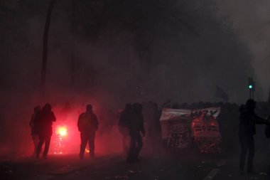 Protesters clash with French riot police during a demonstration against pension reforms in Paris, France, 05 December 2019.  clipart