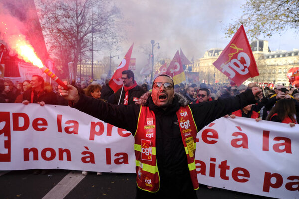 People march during a demonstration against pension reforms in Paris, France, 17 December 2019.