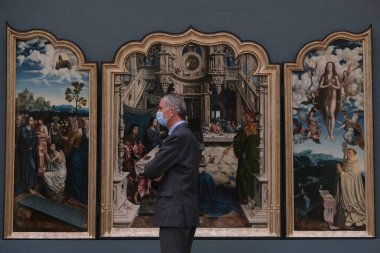 Visitors wear face masks, to prevent the spread of coronavirus, as they look at paintings at the Royal Museum of Fine Arts in Brussels, Belgium on May 19, 2020. clipart