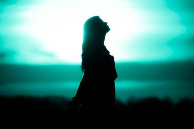 Youth woman soul turquoise sun meditation awaiting future times