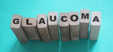 Tahta bloklardan yapılmış glikoma kelimesi, göz sağlığı tıbbi konsepti..