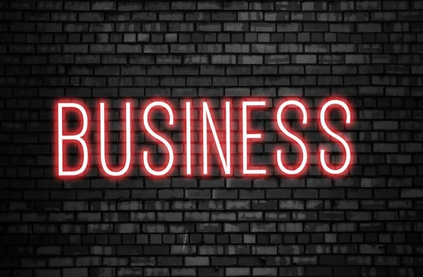 Business Glowing Pink Neon Inscription Dark Brick Wall Background Startup — Stock Photo, Image