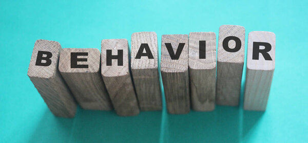 Behavior Word In Wooden Cube. Psychology human resources management concept.