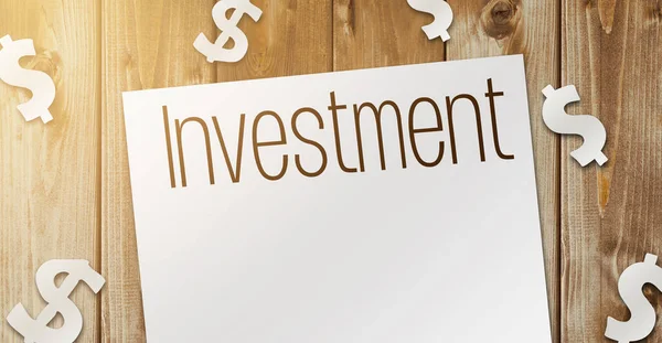 Słowo inwestycji na stronie i papierowe znaki dolara wokół na drewnianym stole. Koncepcja działalności finansowej — Zdjęcie stockowe