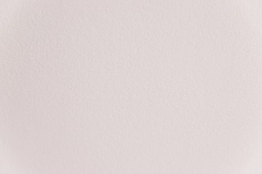 Beyaz duvarın dokusu. Duvarda küçük lekeler var. Duvarlar boyayla boyanmış. Sert yüzey.