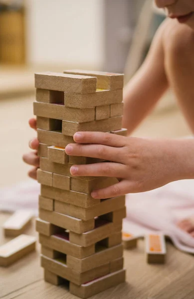 Tower Board game. Home entertainment. Wooden elements of the game. Sit at home.