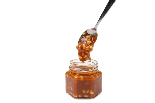 Caramel Flows Spoon Jar White Background — Stock Photo, Image