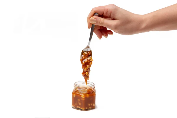 Caramel Flows Spoon Jar White Background — 스톡 사진