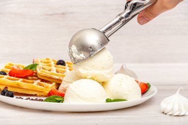 Putting a scoop of ice cream on a plate clipart