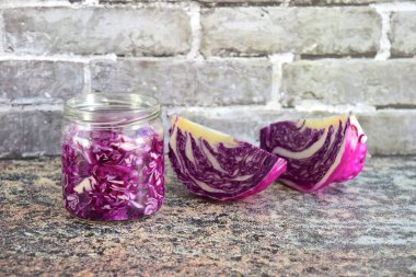 Shredded red cabbage on cutting board