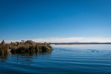Puno, Peru - 10/06/2019: A view of floating islands of Uro natives at Puno, Peru clipart