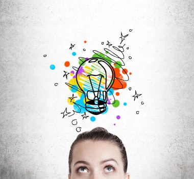 Woman imagining a light bulb