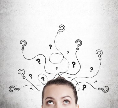 Woman looking at question  marks