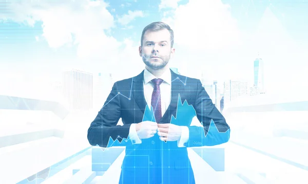 Serious businessman against cityscape with arrows and graphs — Stock Photo, Image