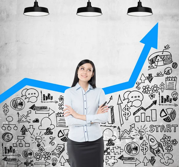 Dreamy girl with blue graph on concrete wall — Stock Photo, Image