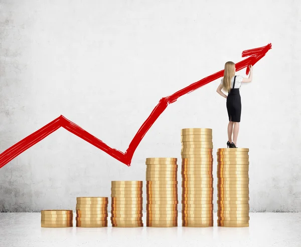 Girl with blond hair standing on coin stack — Stock Photo, Image