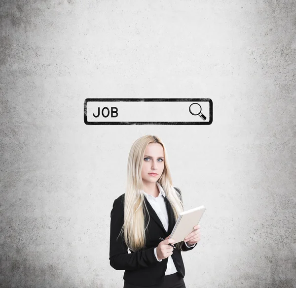 Blond girl with notebook looking for a job — Stock Photo, Image