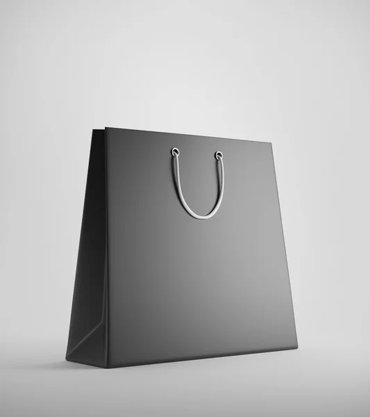 Beyaz arka plana karşı siyah alışveriş çantası — Stok fotoğraf