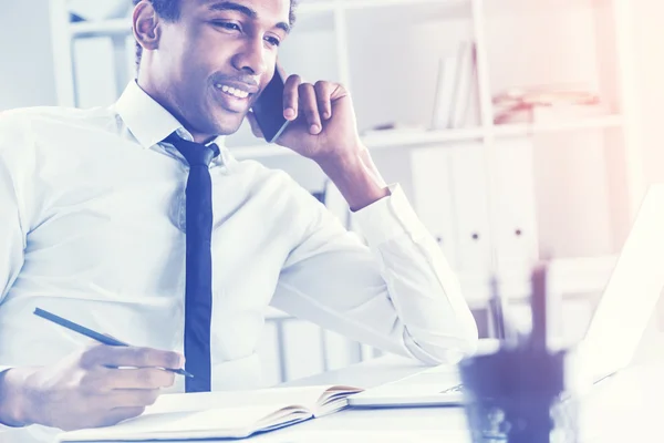 Young black man in an office — ストック写真