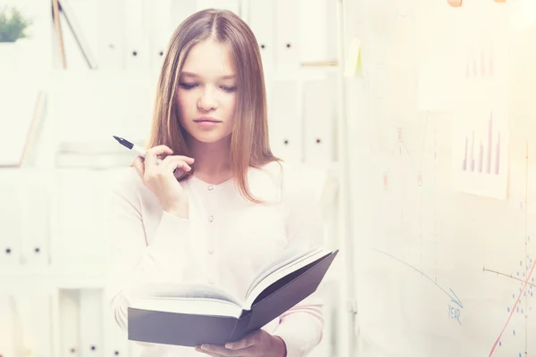 Beatiful office worker with a book — Stock Photo, Image