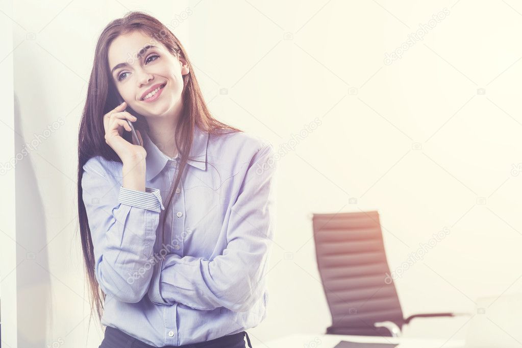 Smiling businesswoman on cellphone