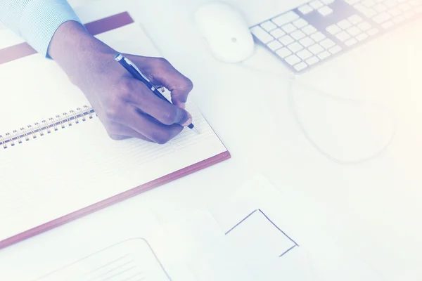 Man hand writing in notebook — Stock Photo, Image