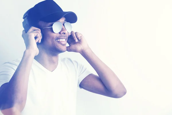 Smiling black guy with large headphones — Stock Photo, Image