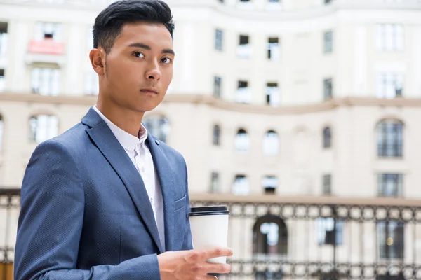 Asian businessman drinking his coffee — Stock Photo, Image
