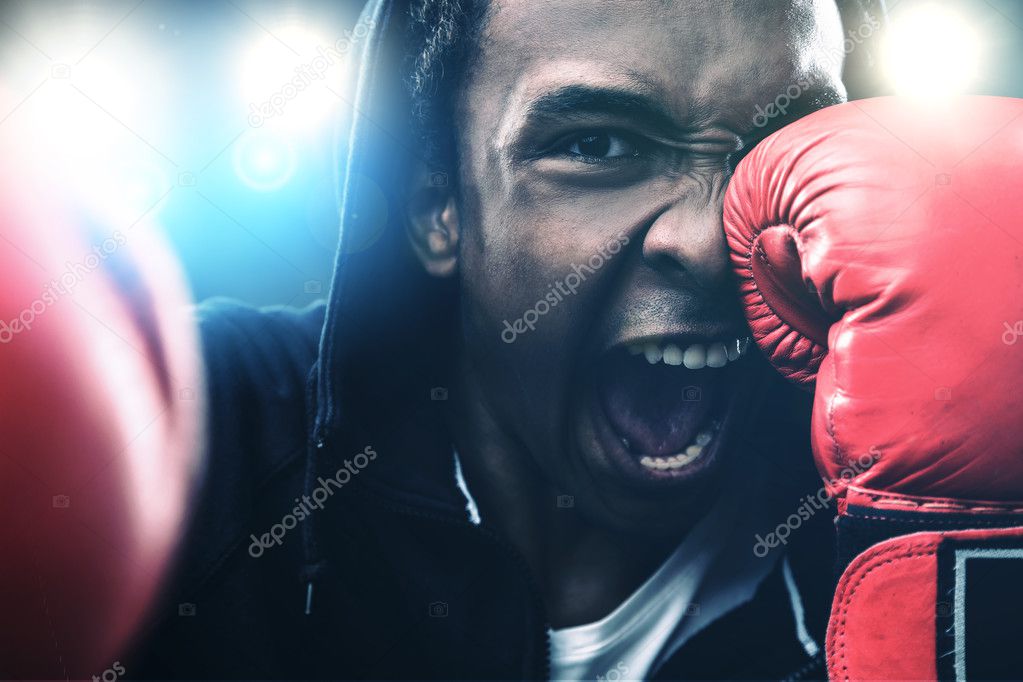 Close up of punching boxer