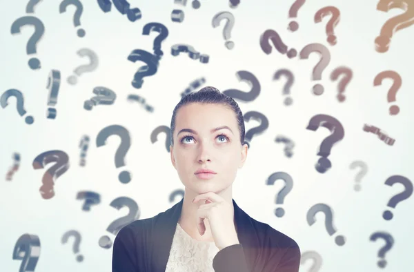 Close up of woman in black and white clothes and floating questi — Stock Photo, Image