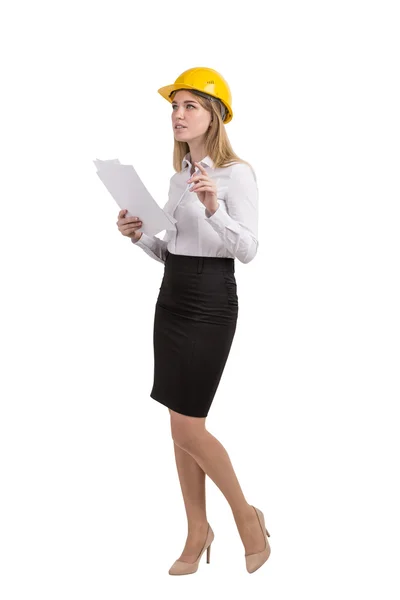 Woman with documents wearing hard hat — Zdjęcie stockowe