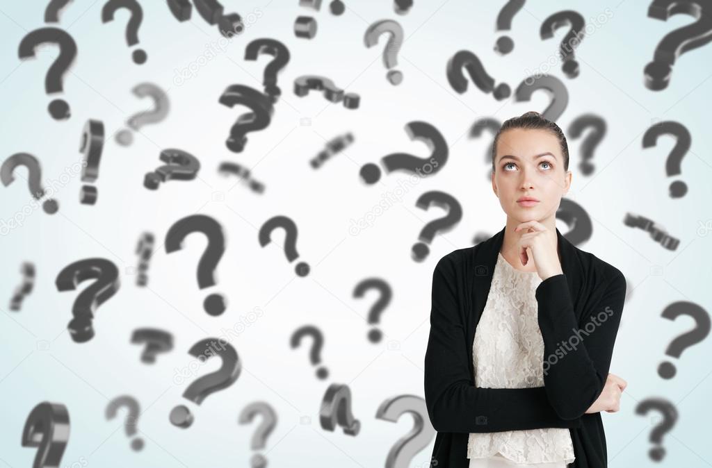 Woman in black and white clothes and floating question marks