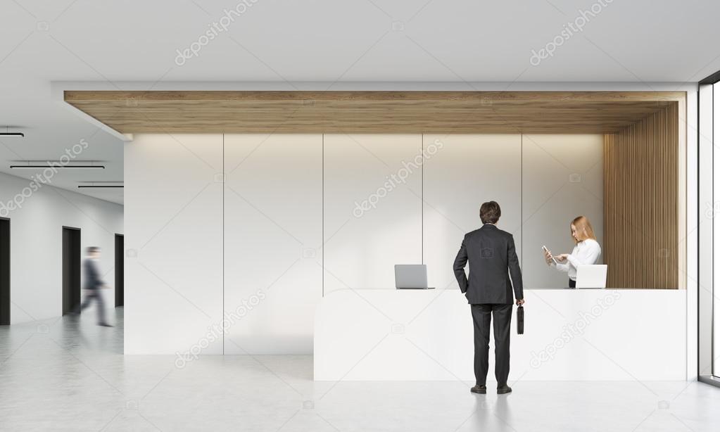 Rear view of man talking on reception