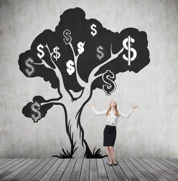 Woman with hands in the air and dollar tree — ストック写真