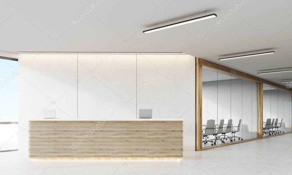 Front view of reception counter in office corridor with wooden e