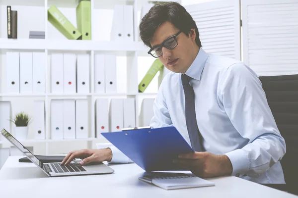 Office employee entering data into the system — Stock Photo, Image