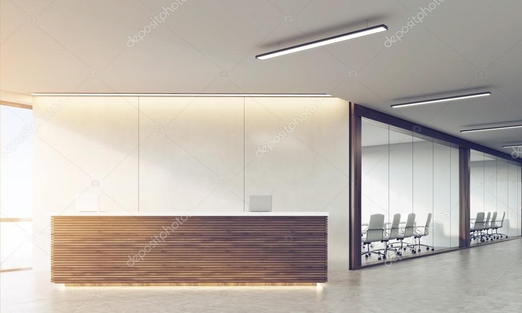 Front view of wooden sunlit reception counter