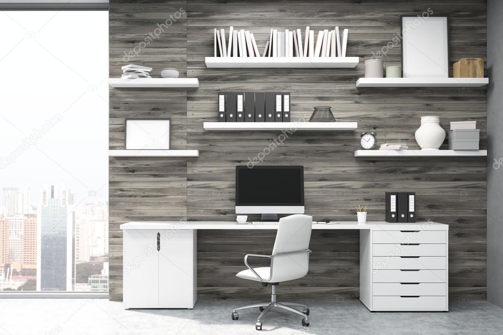 Home office with dark wood panels