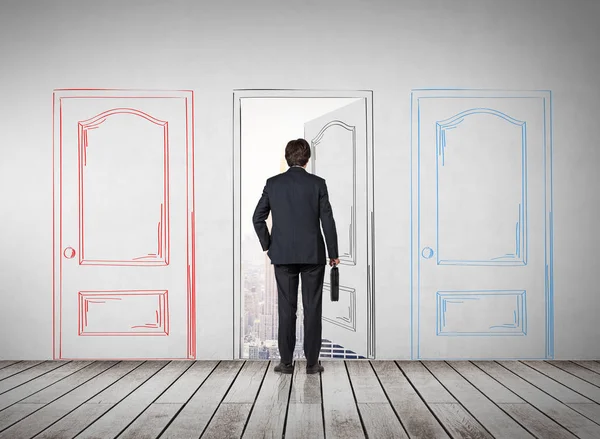 Businessman entering a drawn door — Stock Photo, Image