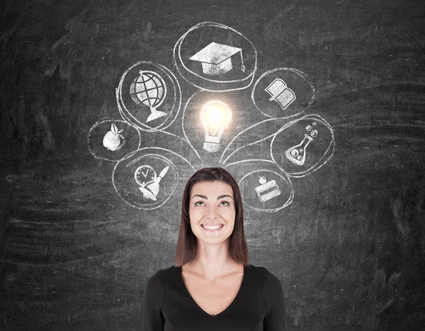 Mujer en negro y los iconos de la educación — Foto de Stock