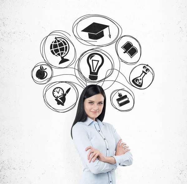 Smiling girl with black hair and education icons — Stock Photo, Image