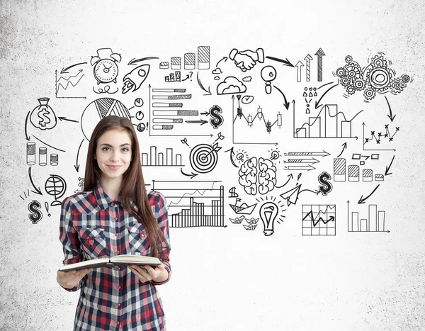 Smiling nerdy girl and black startup sketches — Stock Photo, Image