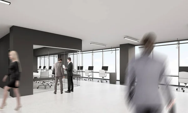People in office with black elements of decoration