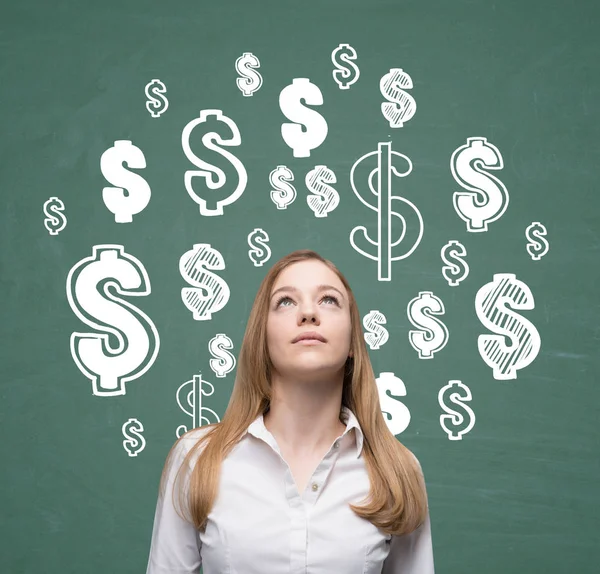 Blond girl looking at dollar signs — Stock Photo, Image