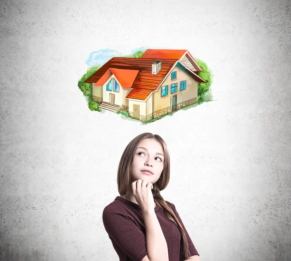 Woman with braided hair is dreaming about her house — Stock Photo, Image