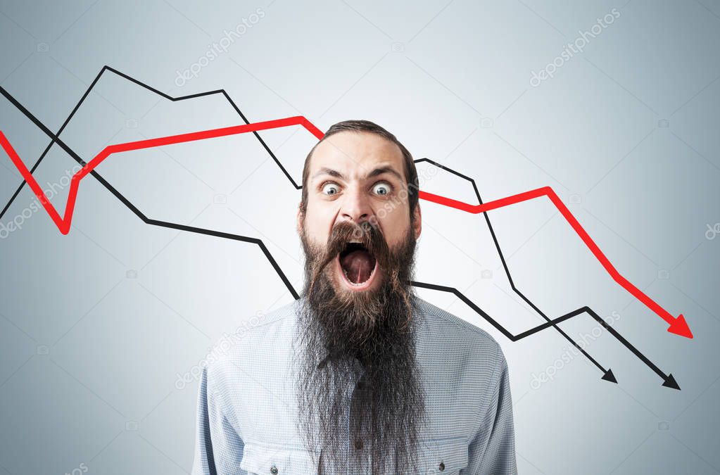 Man shouting at declining graphs